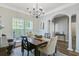 Dining room featuring a chandelier, decorative windows, and ample natural light at 104 Valentin Dr, Summerville, SC 29483