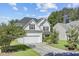 Beautiful home with attached garage, dark roof, light siding, landscaping, and long drive way at 104 Valentin Dr, Summerville, SC 29483