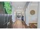 Open foyer with hardwood flooring, archways, dining room view, and decorative accents at 104 Valentin Dr, Summerville, SC 29483