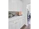 Kitchen with white cabinets, stylish countertop decor, and easy access to dining or living areas at 104 Valentin Dr, Summerville, SC 29483