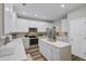 Spacious kitchen with ample white cabinetry, stainless steel appliances, island, and modern finishes at 104 Valentin Dr, Summerville, SC 29483