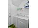 Convenient laundry room with modern washer and dryer and a storage shelf at 104 Valentin Dr, Summerville, SC 29483