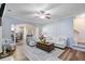 Cozy living room featuring hardwood floors, an area rug, and lots of natural light at 104 Valentin Dr, Summerville, SC 29483
