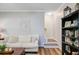 Inviting living room showcasing a staircase and bookshelf with charming décor at 104 Valentin Dr, Summerville, SC 29483