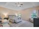 Bright and spacious main bedroom with a tray ceiling, ceiling fan, and natural light at 104 Valentin Dr, Summerville, SC 29483