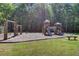A well-maintained playground with a slide and swings is set in a sunny outdoor area at 104 Valentin Dr, Summerville, SC 29483