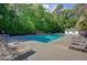 A beautiful clear pool surrounded by lounge chairs offers a refreshing outdoor retreat at 104 Valentin Dr, Summerville, SC 29483