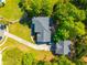 Aerial view of a two-story home with a well-maintained lawn, lush landscaping, and a spacious driveway at 105 Birkbeck Ct, Goose Creek, SC 29445
