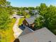 Aerial view showcasing a lush backyard with pool and mature trees surrounding the property at 105 Birkbeck Ct, Goose Creek, SC 29445