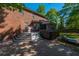 View of the brick patio featuring a hot tub, grill, and outdoor seating in the fenced backyard at 105 Birkbeck Ct, Goose Creek, SC 29445