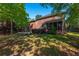 Expansive backyard featuring a brick home, screened porch, and hot tub for outdoor relaxation and entertaining at 105 Birkbeck Ct, Goose Creek, SC 29445