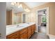 Bathroom with a double vanity, tile floor, and a view to the bedroom at 105 Birkbeck Ct, Goose Creek, SC 29445