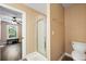 Bathroom with a glass enclosed shower, toilet, and view to the bedroom at 105 Birkbeck Ct, Goose Creek, SC 29445