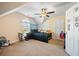 Bedroom with cream colored walls, a ceiling fan, a window, and a black bed at 105 Birkbeck Ct, Goose Creek, SC 29445