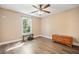Bedroom with neutral walls, hardwood floors, ceiling fan, and natural light from a window at 105 Birkbeck Ct, Goose Creek, SC 29445
