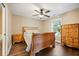 Cozy bedroom with natural wood furniture, ceiling fan, and window with natural light at 105 Birkbeck Ct, Goose Creek, SC 29445
