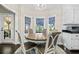 Cozy breakfast nook with a round table, patterned window treatments, and a view of the outdoors at 105 Birkbeck Ct, Goose Creek, SC 29445
