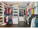 Walk-in closet with custom shelves, hanging rods, and plenty of storage space for clothes and accessories at 105 Birkbeck Ct, Goose Creek, SC 29445
