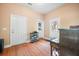 Mud room with wood floors, three white doors, shoe storage, and a piano at 105 Birkbeck Ct, Goose Creek, SC 29445
