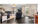Cozy living room with dark hardwood floors, comfortable leather seating, and a mounted television at 105 Birkbeck Ct, Goose Creek, SC 29445