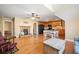 Open-concept living room with hardwood floors, fireplace, and a kitchen with oak cabinets at 105 Birkbeck Ct, Goose Creek, SC 29445