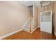 Stairway with carpeted steps, an elevator, and a tan colored wall at 105 Birkbeck Ct, Goose Creek, SC 29445