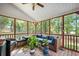 Relaxing screened-in porch with comfortable seating and views of the surrounding greenery at 105 Birkbeck Ct, Goose Creek, SC 29445