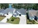 Overhead view of a stylish home with lake views, and lush landscaping at 108 Bluff Isle Ct, Summerville, SC 29486