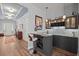Home bar area with stylish cabinetry, tile backsplash, and seating at 108 Bluff Isle Ct, Summerville, SC 29486