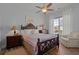 Cozy bedroom with natural light, beautiful wooden furniture, and a ceiling fan at 108 Bluff Isle Ct, Summerville, SC 29486