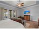 Large bedroom with wooden floors, furniture, ceiling fan, and waterfront views at 108 Bluff Isle Ct, Summerville, SC 29486