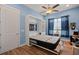 Murphy bed pulled down in blue bedroom with wood flooring at 108 Bluff Isle Ct, Summerville, SC 29486