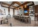 Bright cafe featuring a long bar with seating, wooden beams, and decorative shelving at 108 Bluff Isle Ct, Summerville, SC 29486