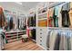 Walk-in closet with custom shelving, cabinets, and drawers for ample storage at 108 Bluff Isle Ct, Summerville, SC 29486