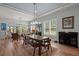 Inviting dining room with modern chandelier, large windows, and an area rug at 108 Bluff Isle Ct, Summerville, SC 29486