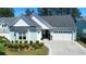 Beautiful home with a well-kept lawn, lush landscaping, and a charming front entrance at 108 Bluff Isle Ct, Summerville, SC 29486