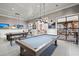 Spacious game room with a pool table, high ceilings, stylish lighting and comfortable seating at 108 Bluff Isle Ct, Summerville, SC 29486