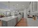 Spacious kitchen boasts a large island with breakfast bar, modern appliances, and open concept living at 108 Bluff Isle Ct, Summerville, SC 29486