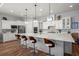 Modern kitchen features a large island, stainless steel appliances, and custom white cabinetry at 108 Bluff Isle Ct, Summerville, SC 29486