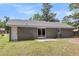 Exterior features a well-maintained backyard with patio and gray brick and siding at 108 Wadmalaw Cir, Summerville, SC 29483