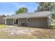 Cozy backyard with a painted brick exterior and sliding glass door, perfect for outdoor enjoyment at 108 Wadmalaw Cir, Summerville, SC 29483