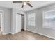 This bedroom features laminate flooring, closet, a ceiling fan, and windows for natural light at 108 Wadmalaw Cir, Summerville, SC 29483