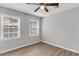 Bedroom featuring natural lighting, laminate floors, a ceiling fan, and two windows overlooking the outdoors at 108 Wadmalaw Cir, Summerville, SC 29483