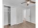 Comfortable bedroom with laminate flooring, closet, and a ceiling fan for enhanced airflow and comfort at 108 Wadmalaw Cir, Summerville, SC 29483