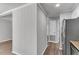 Hallway with wood-look flooring leads to multiple rooms at 108 Wadmalaw Cir, Summerville, SC 29483