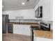 Kitchen features white cabinets, stainless steel appliances and a double basin sink at 108 Wadmalaw Cir, Summerville, SC 29483