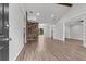 Bright and airy living room featuring wood flooring, neutral walls, a brick accent wall, and vaulted ceilings with wood beams at 108 Wadmalaw Cir, Summerville, SC 29483