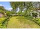 The home's backyard has beautiful landscaping and a very well-manicured lawn at 110 Jackson Rd, Ladson, SC 29456