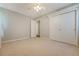 This spacious bedroom features neutral tones, a ceiling fan, and ample closet space at 110 Jackson Rd, Ladson, SC 29456