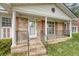 Welcoming front porch with brick steps and decorative railings, showcasing the home's entrance at 110 Jackson Rd, Ladson, SC 29456